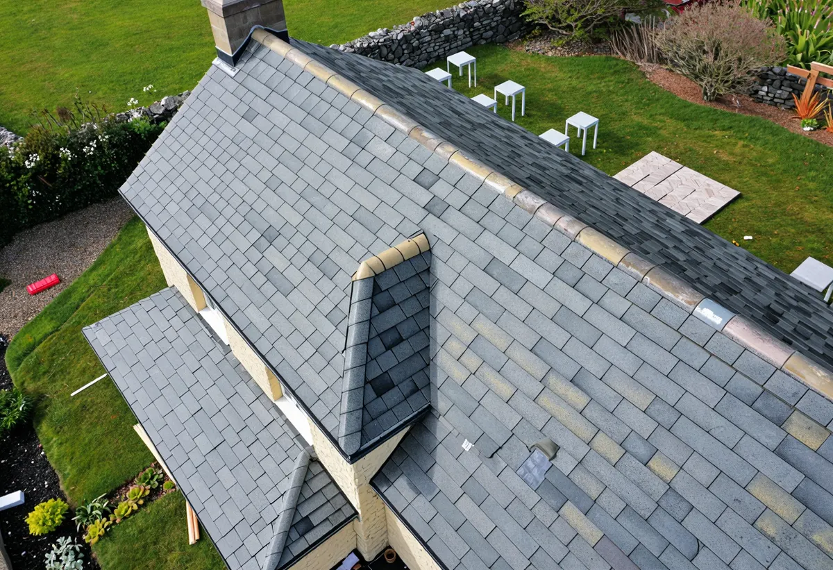 Aerial view of a completed slate roof with neat ridge line